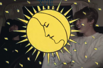 An image of Yoongi and Jimin from BTS, with a moon and flecks of light taken from the Ryder Waite tarot deck in yellow superimposed over the top of the image.