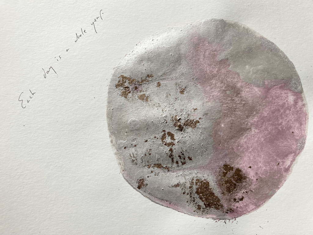 A watercolour painting. It is a grey circle, with lilac bleeding into it.